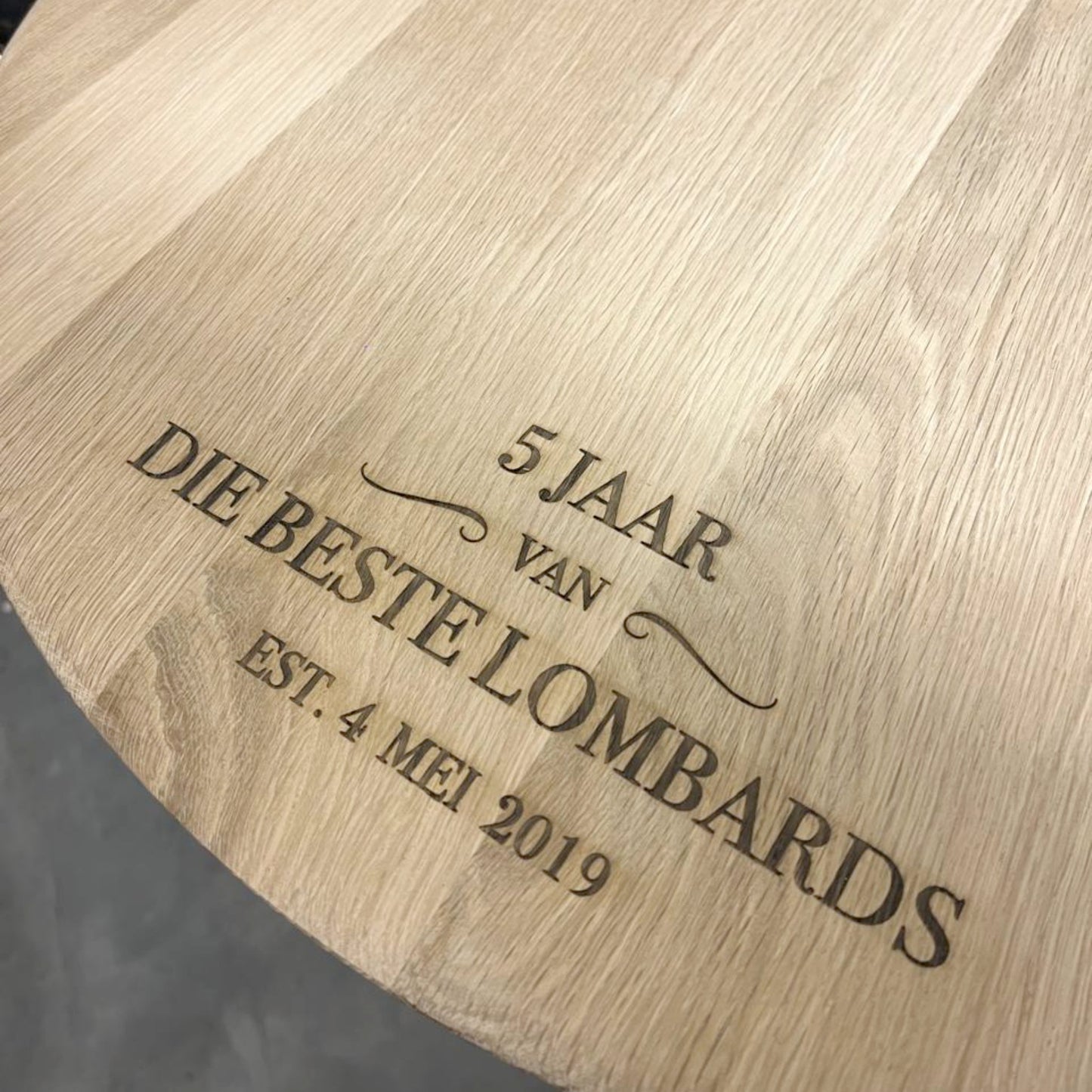 Large round oak barrel cheese board with custom laser engraving.