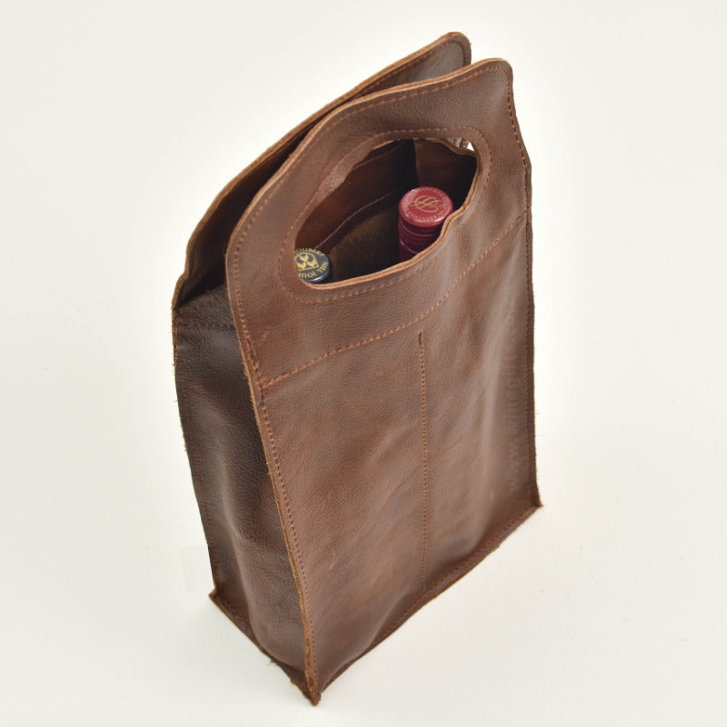 Brown leather bag with a white background