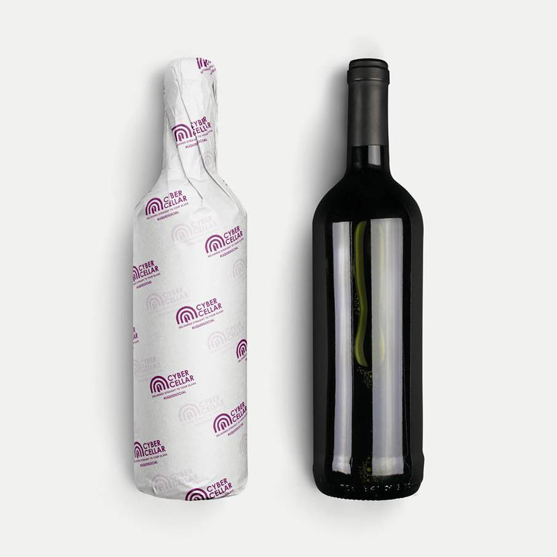 Wine bottle with and without its tissue paper wrap on a white background