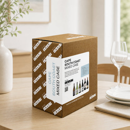 Cape South Coast mixed case wine box on a table with a dining setup in the background
