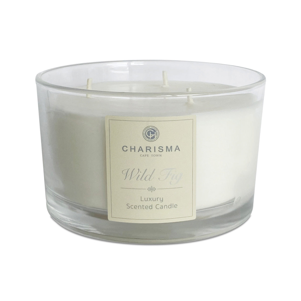 Clear glass candle with a label on a white background