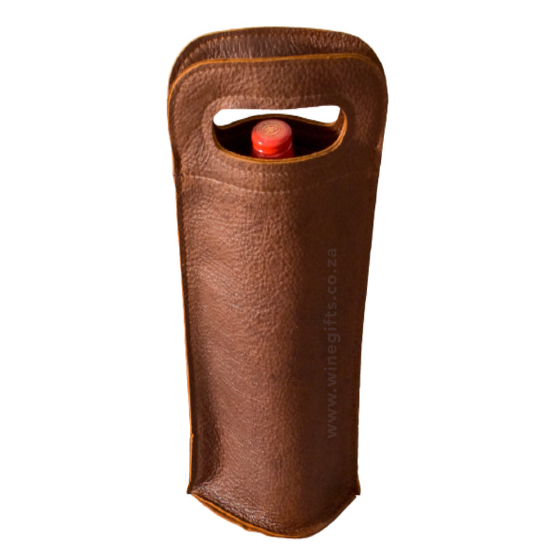 Brown leather wine bottle holder with a red wine bottle on a white background