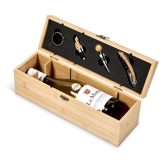 Wine bottle in a wooden box with corkscrew and other tools on a white background