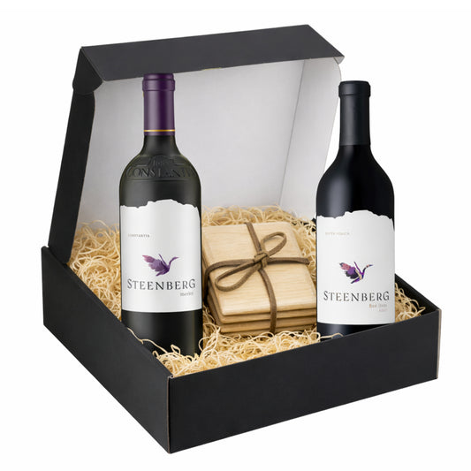 Two bottles of Steenberg wine in a gift box with a oak coasters tied with a leather strap.
