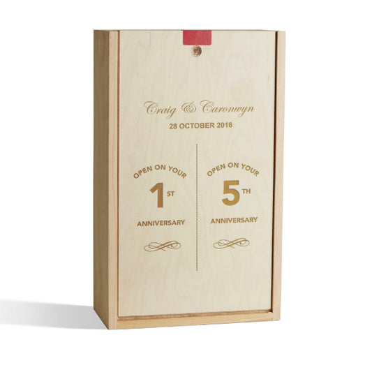 Wooden box with engraved text for anniversary celebrations on a white background