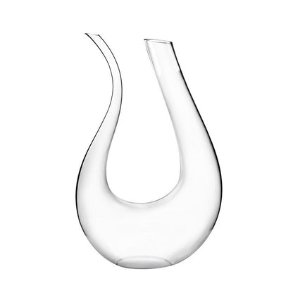 Clear glass wine decanter on a white background